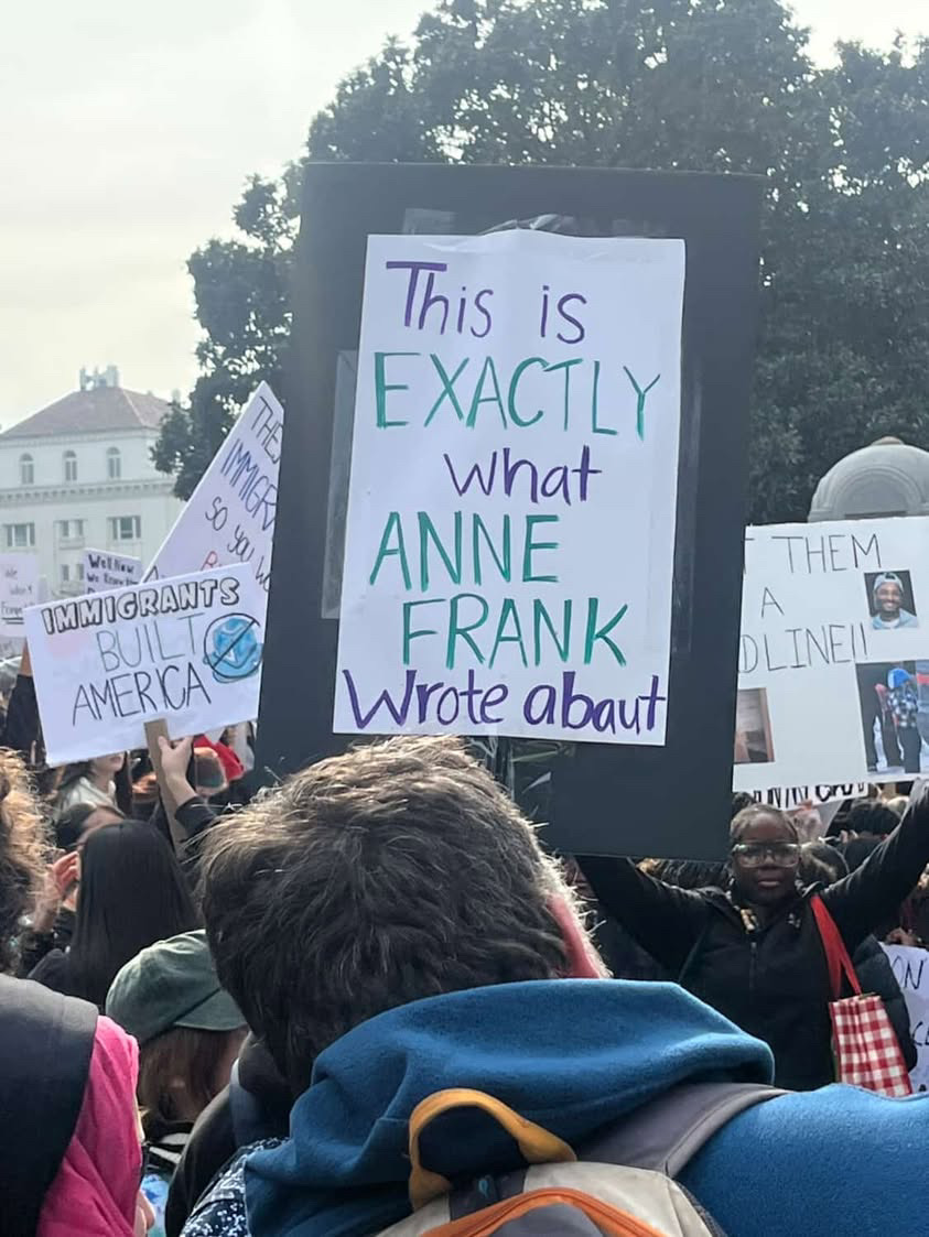 A student holding a sign referencing Anne Frank, a Jewish teenager and Holocaust victim most well known for her diary. The sign was held outside the capitol on Jan 30.