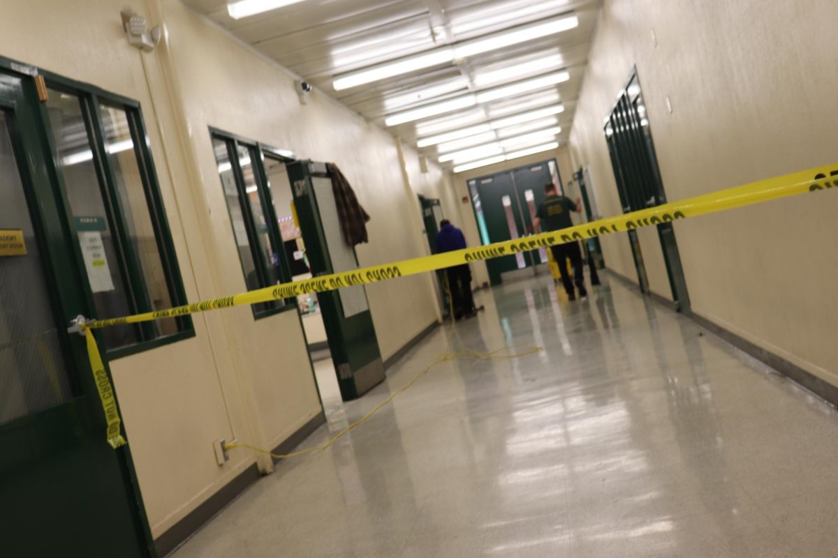 JFK Staff place "Crime scene" tape around the wet floor in the B building around 30 minutes after the incident. This was made to keep students away from the wet area.