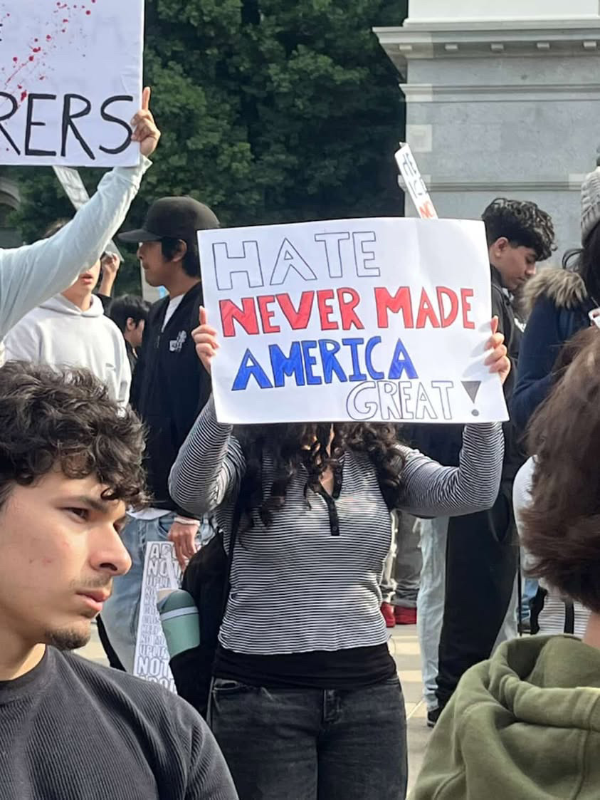 A protestor at a student walkout holds up a sign protesting ICE involvement in communities Jan 30. This is one of two walkouts led by students, with the other being hosted on Feb 27.