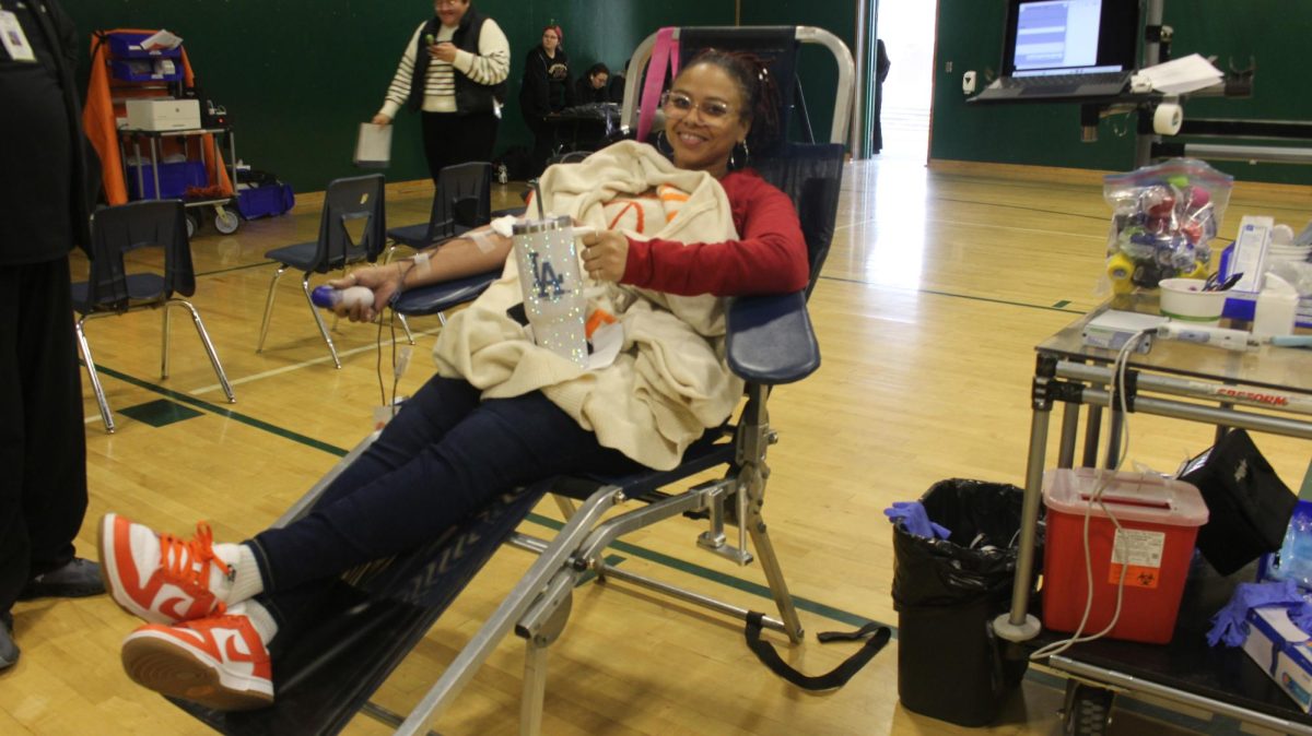 Teacher, Ms.Watson donates blood in the small gym on Jan 22. This was the first blood drive since covid 19.