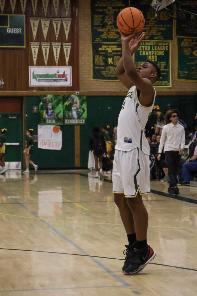 On February 11 at the Kennedy gym, Cameron Thomas is taking a easy two point shot. He finished the game with 8 points.