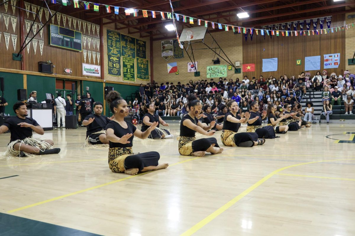 Pacific Islander Club during their performance at the Multicultural rally on Friday March 20 at the Kennedy gym. This was the start of the performance where dancers took their sandals off and sat down.