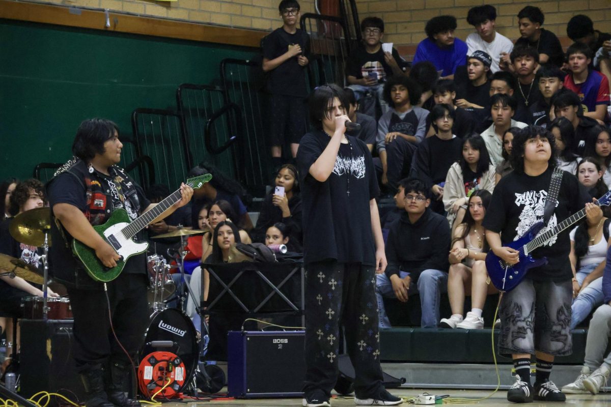 Lead singer for the band Eschaton performs at Kennedy's Multicultural rally on Friday March 20 at the Kennedy gym. This was one of their many performances as they performed in the quad on March 24.
