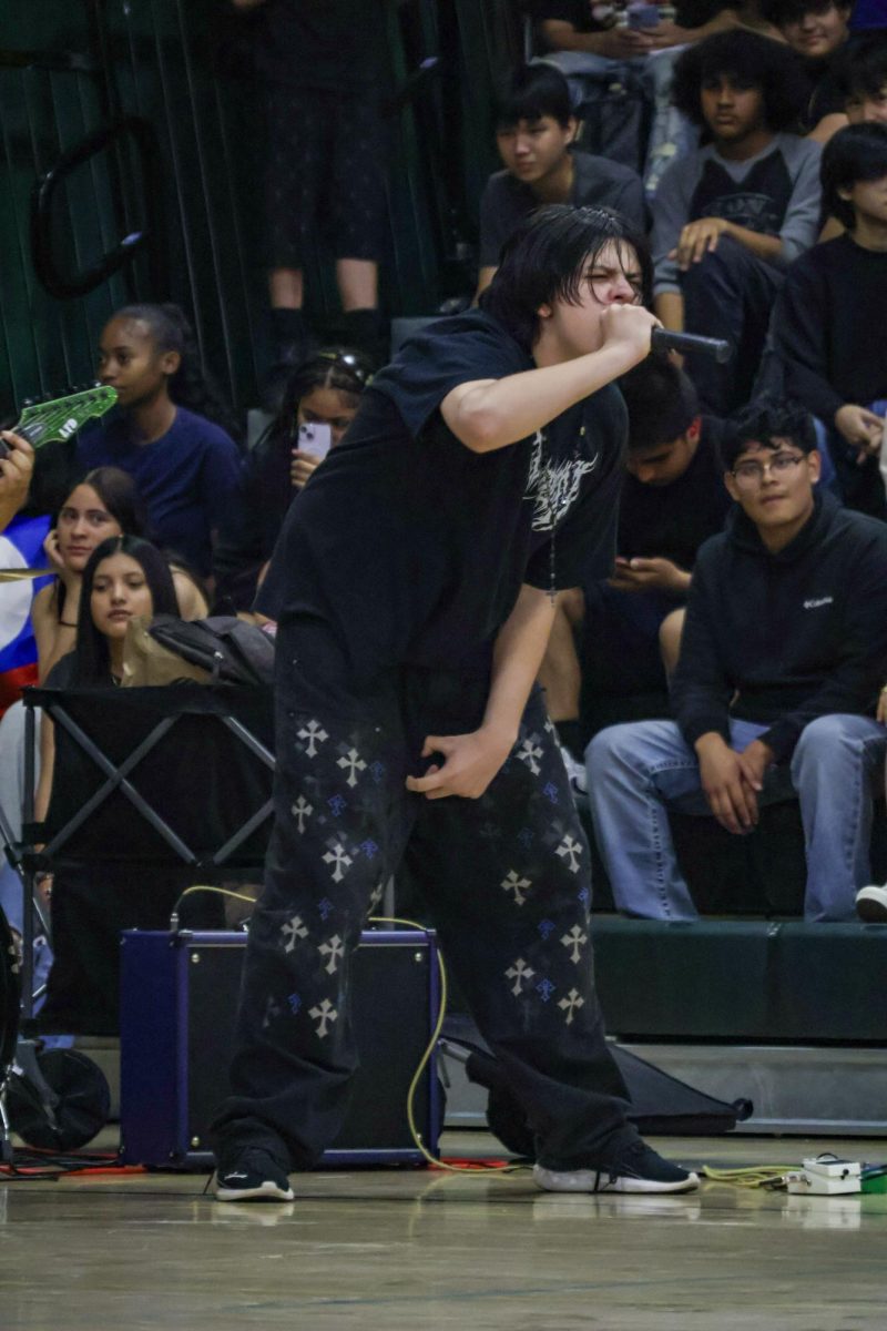 Lead singer for the band Eschaton performs at Kennedy's Multicultural rally on Friday March 20 at the Kennedy gym. This was one of their many performances as they performed in the quad on March 24.