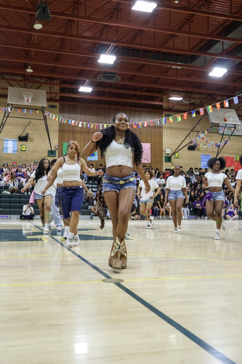 JFK Cheer and BSU do their dance routine at the JFK Multicultural rally on March 20. This was one of the many performances at the rally.