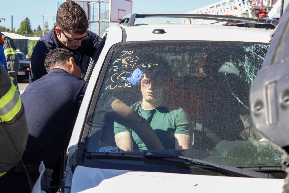 Tyler Woodard being assessed for his injuries after the crash. Tyler was then put onto a stretcher and awaited air transportation.