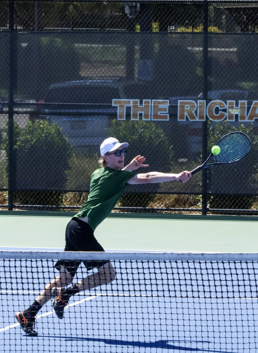 Elliott Potter Klein returns a hit from his opponent during his singles match, later scoring the point on Thursday, May 14, at the Division III Championships. Klein unfortunately lost the match due to poor calls and "an off day."