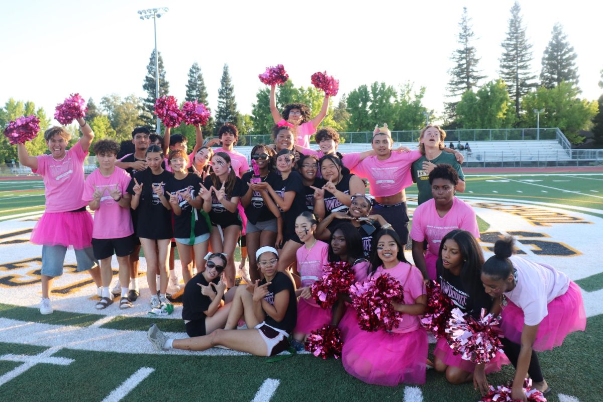 Players, cheerleaders, and coaches come together for a group photo after the PowderPuff game, with the senior team holding up the trophy in celebration on Thursday, May 21. Both teams showed great energy and sportsmanship throughout the game.